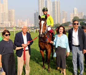 Mrs and Mr Vijay Shirke, Mrs Liane Luthra and Milan Luthria leading in Psychic Star (Vivek G up), winner of A C Ardeshir Trophy at Mumbai on Sunday.